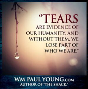 Inspirational quote about tears and humanity with a hanging water droplet.