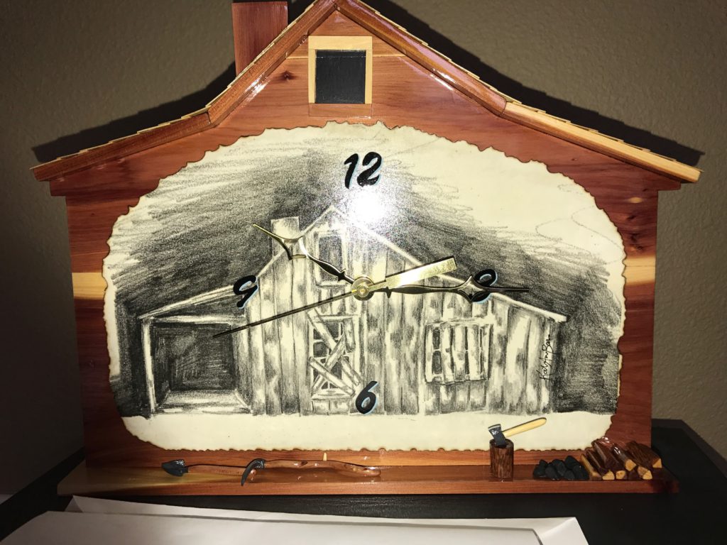 Wooden house-shaped clock with barn illustration.
